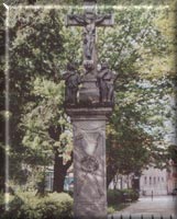Krucyfiks z rzebami w. Rozalii i w. Rocha na figurze wystawionej przez mieszczan skalbmierskich w podzice za ocalenie miasta przed epidemi cholery (1849 r.).